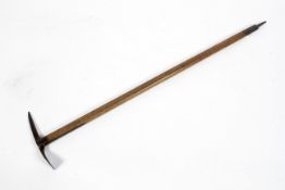An early 20th century ice pick axe, with serrated steel blade,