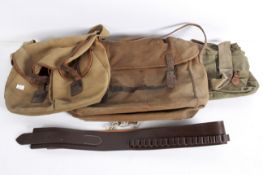 Three vintage canvas fishing bags and a brown leather ammunition gun belt