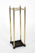 A brass and iron four section umbrella stand, 63cm high,