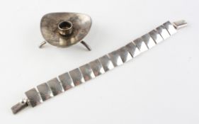 A Danish silver bracelet, stamped 925; together with a footed candlestick,