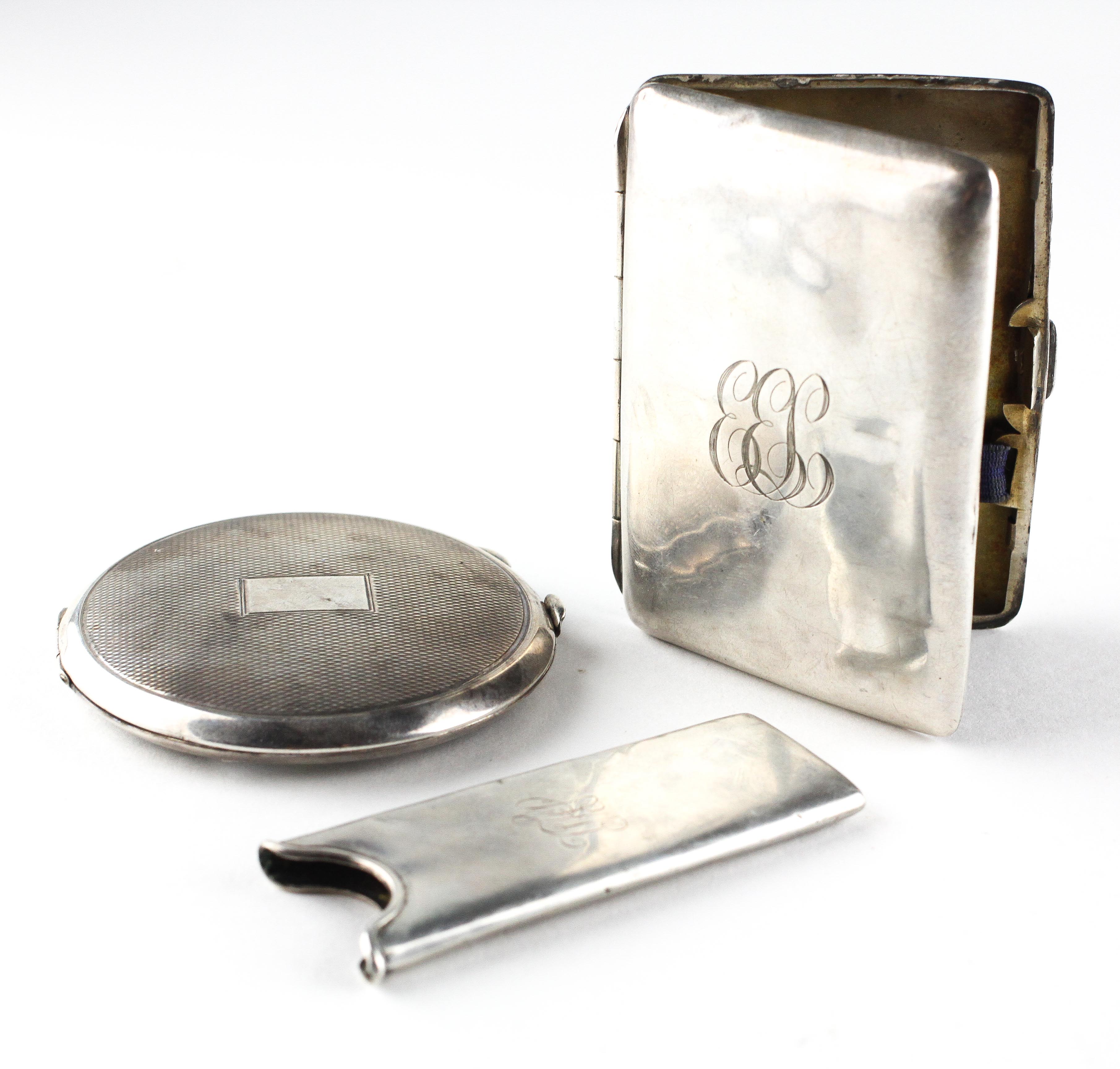 A silver cigarette case of rectangular form, hallmarked Birmingham 1915,