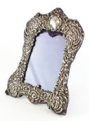 An embossed silver photo frame,