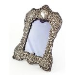 An embossed silver photo frame,