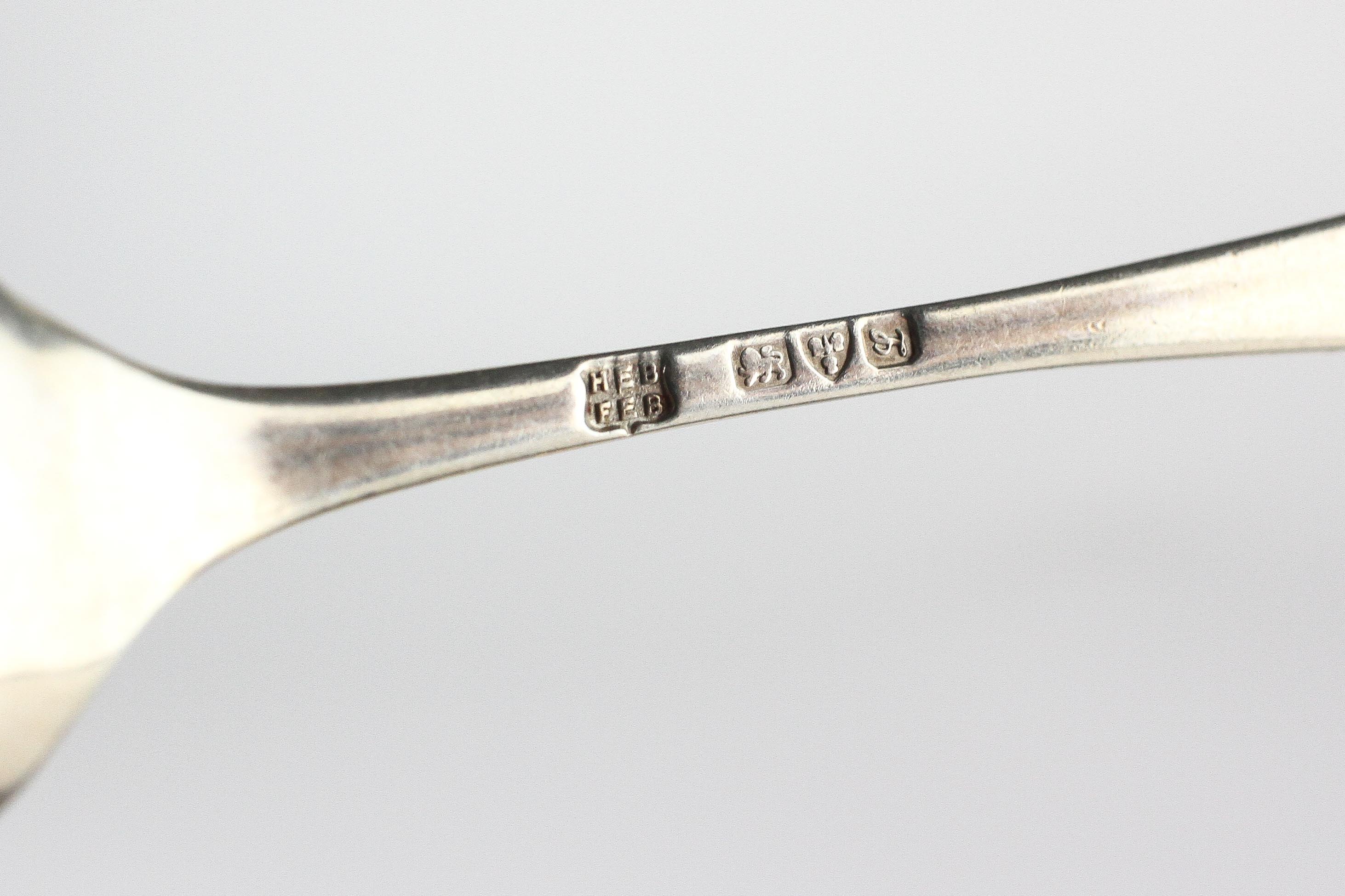 An early 20th century cased set of twelve silver teaspoons with matching sugar tongs, - Image 3 of 3