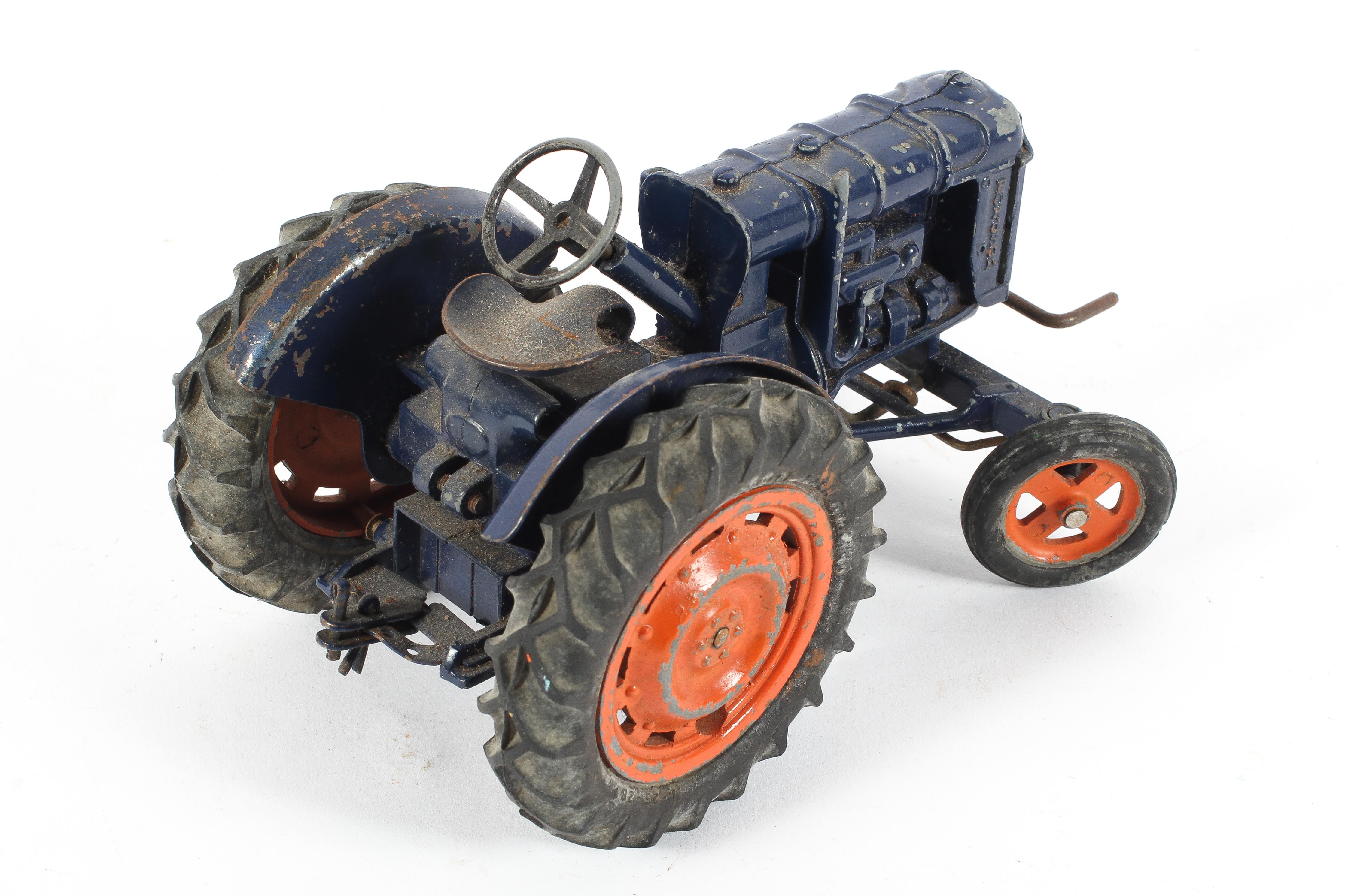 A Chad Valley 1/16 scale Fordson clockwork tractor, in blue and orange ...