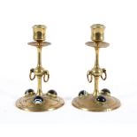 A pair of late Victorian brass agate-mounted candlesticks, late 19th/early 20th century,