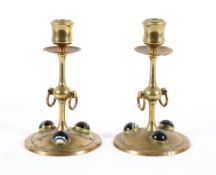 A pair of late Victorian brass agate-mounted candlesticks, late 19th/early 20th century,