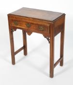 A George III mahogany cross-banded low boy, with frieze drawer,