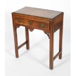 A George III mahogany cross-banded low boy, with frieze drawer,