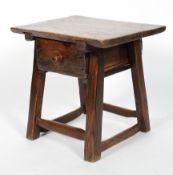 An oak side table, perhaps continental and 18th century, the top above a single drawer, 49cm high,
