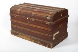 A vintage red painted domed travelling trunk, early 20th century, named for J S Dunn,