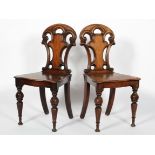 A pair of Victorian mahogany and oak hall chairs, late 19th century,