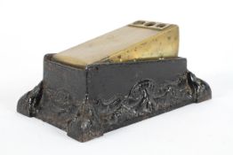 An Edwardian brass and metal cigar cutter, of rectangular form,