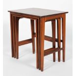 A nest of G-Plan style teak occasional tables, 54cm high, 53cm wide,