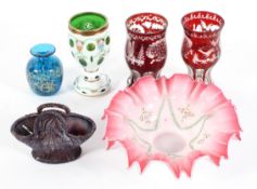 A collection of coloured glass to include a pair of Bohemian style ruby flash vases,