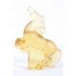 A Lalique frosted amber rearing Kazak horse, etched Lalique/France mark, on a clear plinth base,