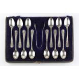 An early 20th century cased set of twelve silver teaspoons with matching sugar tongs,