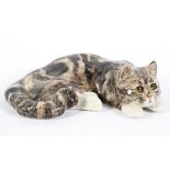 A Winstanley Pottery model of a cat, naturalistically modelled with black and grey markings,