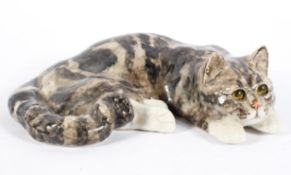 A Winstanley Pottery model of a cat, naturalistically modelled with black and grey markings,