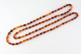 A single strand of orange beads. Strung plain with no clasp.