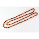 A single strand of orange beads. Strung plain with no clasp.