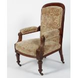 A Victorian walnut armchair, the arched back above upholstered arms, stuffed over seat,