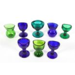 A collection of glass eye baths, mostly 19th/early 20th century,