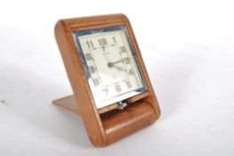 A Jaeger-le-Coultre travel clock, the art deco style rectangular dial with arabic numerals,