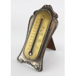 An Art Nouveau silver-mounted brass thermometer, hallmarked Birmingham, 1904, William Hutton & Sons,