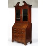 A George III and later mahogany bureau bookcase,