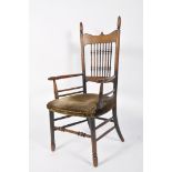 An Arts and Crafts oak chair, in the manner of William Birch,