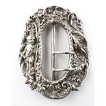 An ornate late Victorian silver belt buckle,