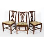 A pair of George III mahogany dining chairs, with pierced splats and drop in seats,