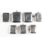 A selection of seven silver vesta cases, each of varying shape and design,