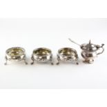 A pair of Victorian silver open salts of cauldron form, raised upon three lion paw feet,