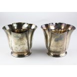 A pair of late Victorian silver cups of fluted form on pedestal style base, hallmarked London 1900,
