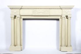 An Adam style fire surround, early/mid 19th century, now cream painted,