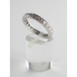 A white metal full eternity ring.