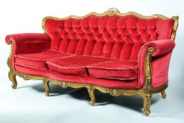 A French neo-rococo style giltwood three seater sofa, probably early 20th century,