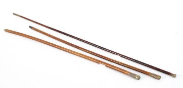 Three brass-mounted wooden swagger sticks,
