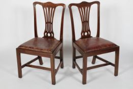 A pair of George III mahogany dining chairs, circa 1800, with pierced waisted splat,