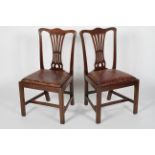 A pair of George III mahogany dining chairs, circa 1800, with pierced waisted splat,