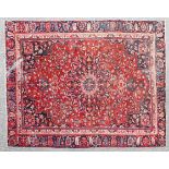 A Khorasan Carpet, the raspberry field with a central medallion,