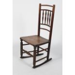 An ash and elm rocking chair, 19th century, with spindle back, two plank seat and box stretcher,