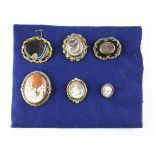 A collection of collection of large abstract brooches to include three mourning,