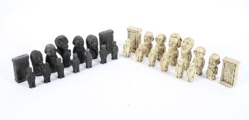 A 1970's resin satirical politicians chess set, in ivory and ebony colours,