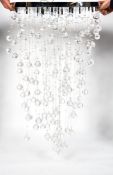 A modern chandelier, with cut glass faceted spheres, 60cm diameter,