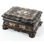 A Victorian papier mache sewing box, inlaid with mother of pearl, with fitted interior and contents,