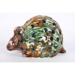 A Chinese Sancai censer, in the form of a rat or hedgehog, with brown, orange and green glazing,
