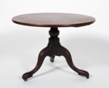 A Georgian mahogany low tripod table, late 18th century, later adapted as a sofa table,